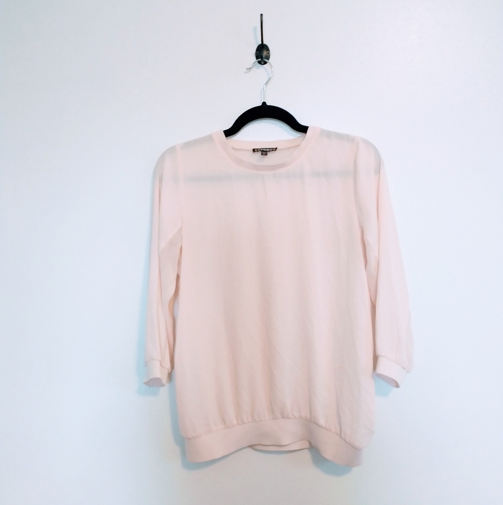 Express pale pink top with scoop neck and sheer panel. Size xs. Two small spot